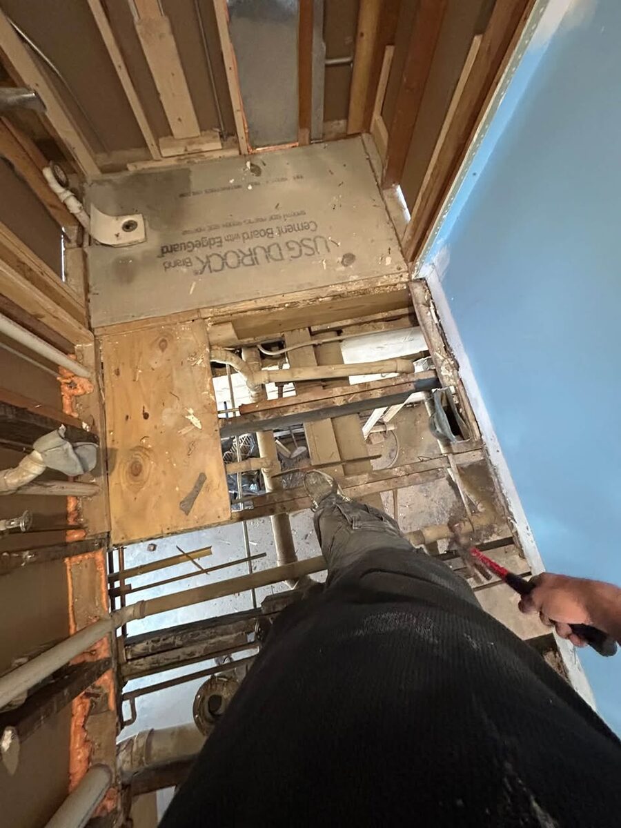 Wall and floor framing exposed during a home repair