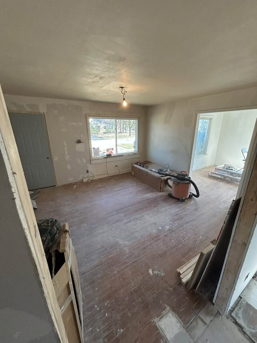Interior room undergoing drywall and floor repair by J&J Pro Services